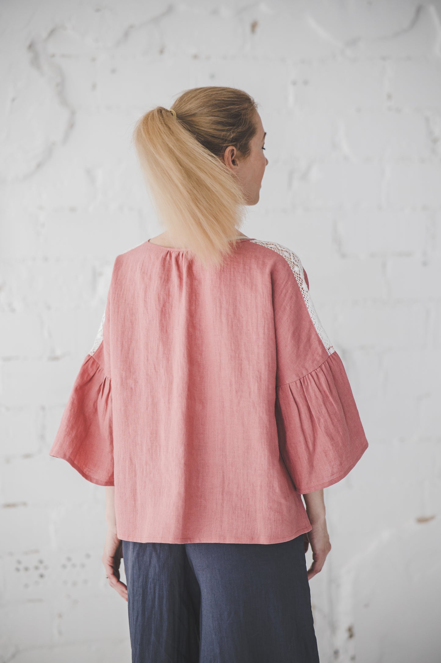 RŪTA linen blouse with crochet lace in Coral