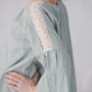 RŪTA linen blouse with crochet lace in Light sage