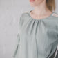 RŪTA linen blouse with crochet lace in Light sage