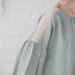 RŪTA linen blouse with crochet lace in Light sage