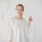 RŪTA linen blouse with crochet lace in Off-white