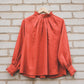 META linen blouse with puffy sleeves & frills in Orange