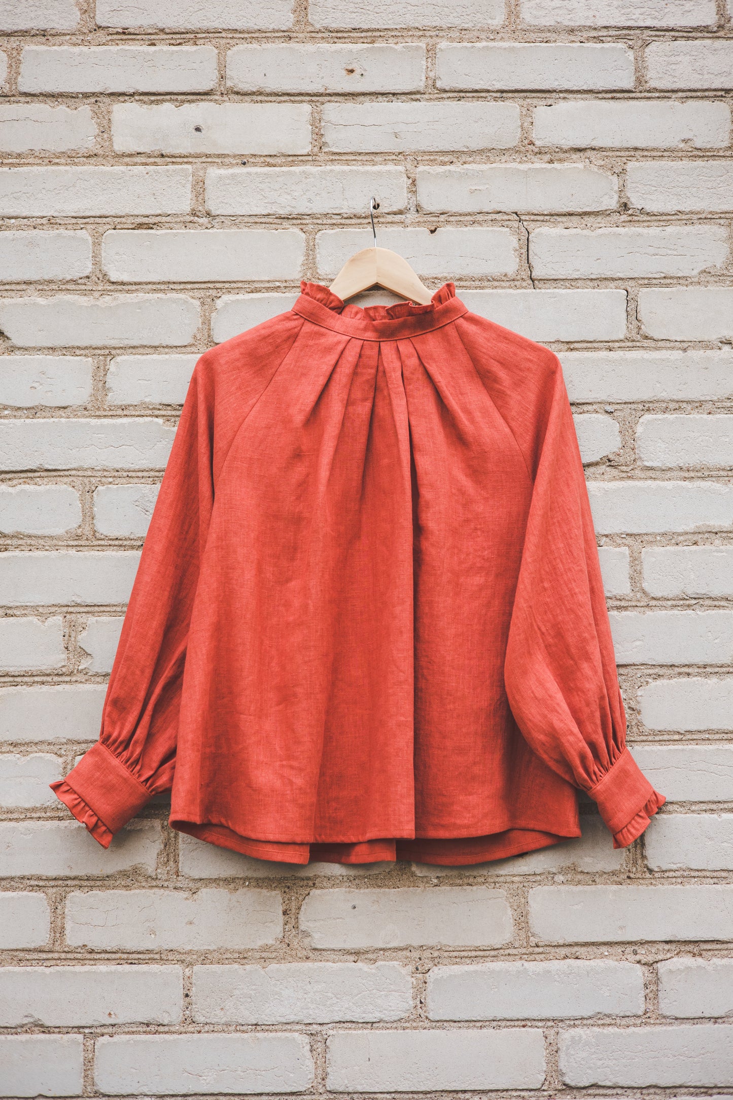 META linen blouse with puffy sleeves & frills in Orange