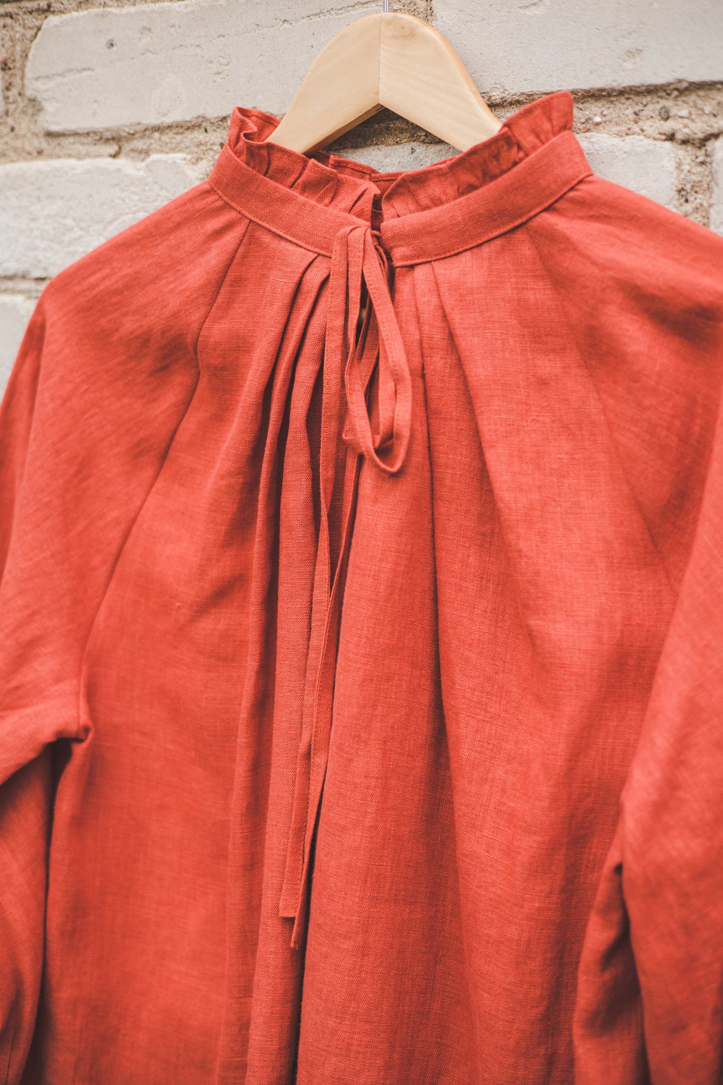 META linen blouse with puffy sleeves & frills in Orange