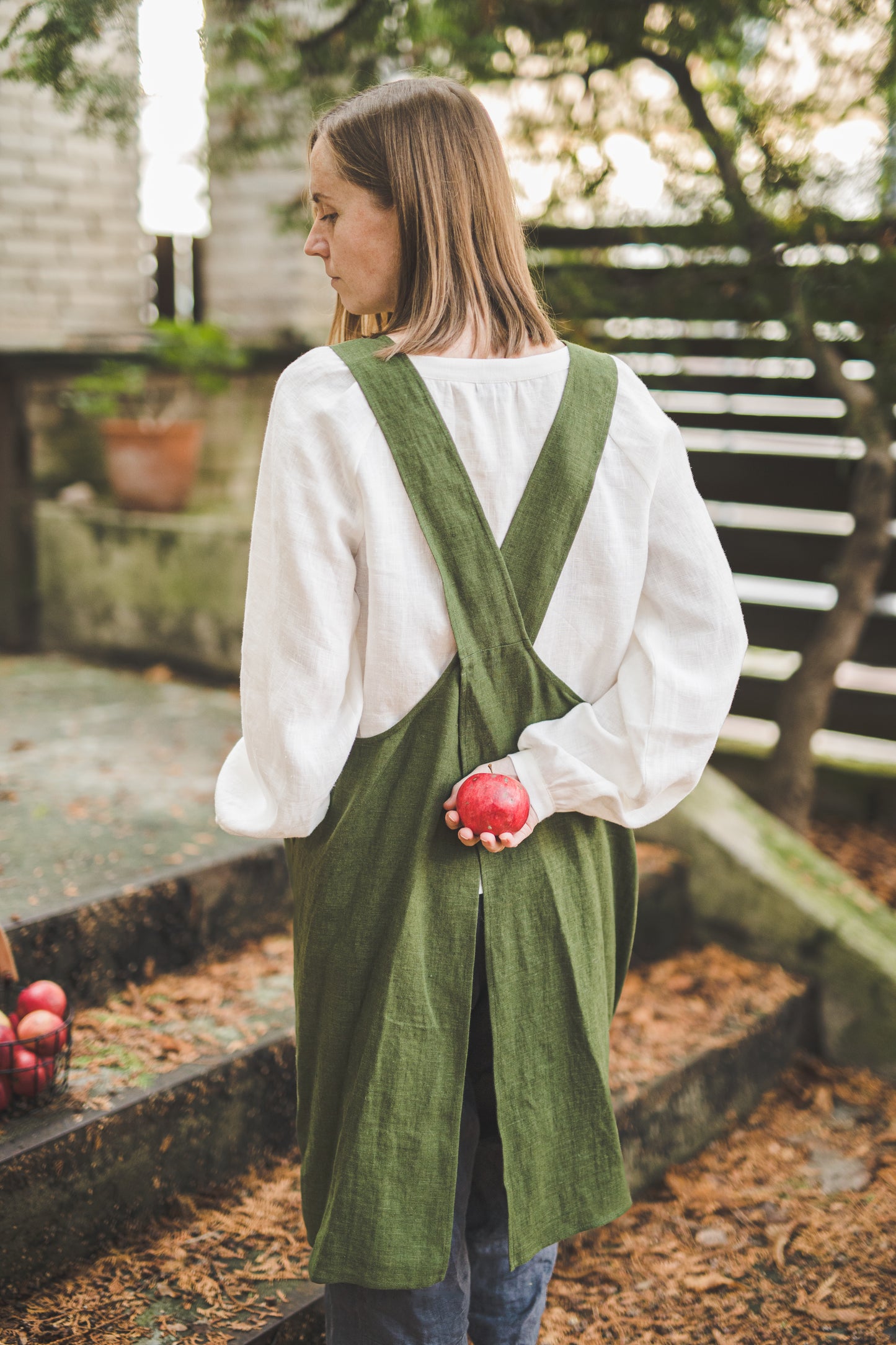 Crossback Pinafore apron with pockets in Forest green