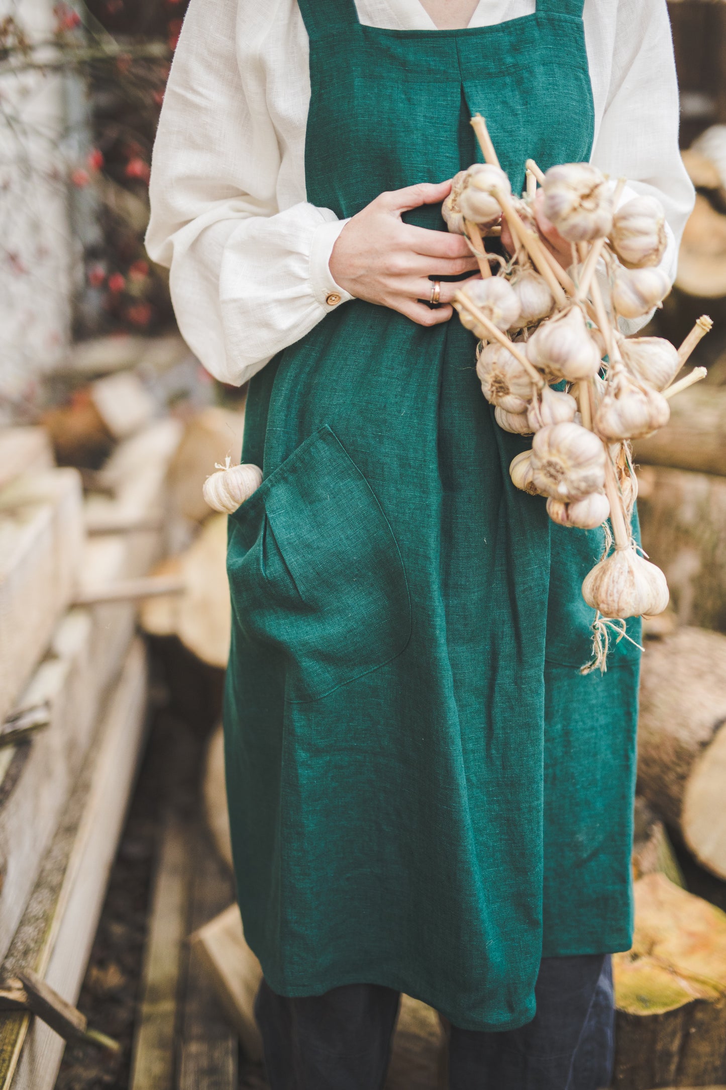 Crossback Pinafore apron with pockets in Emerald green