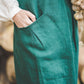 Crossback Pinafore apron with pockets in Emerald green