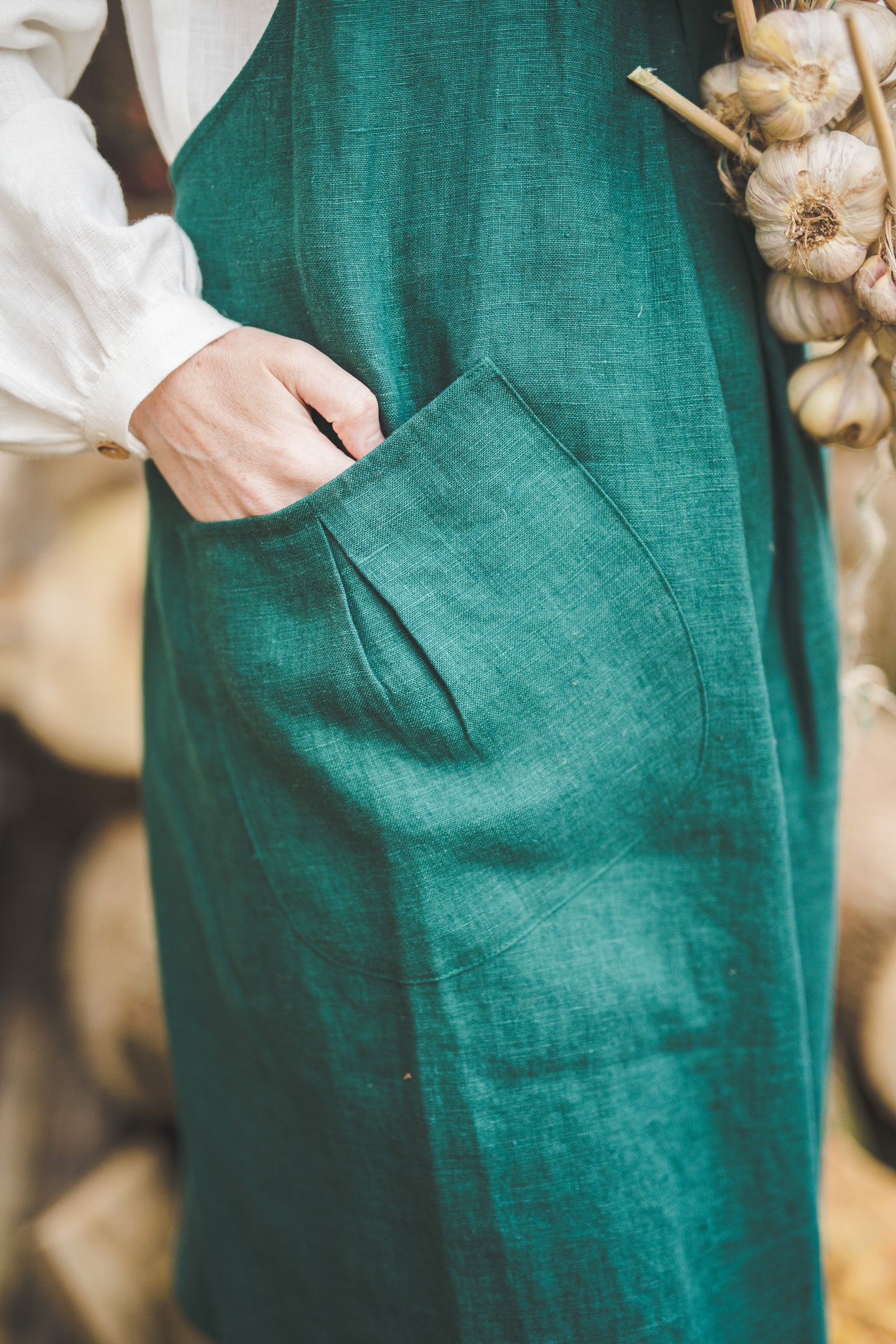 Crossback Pinafore apron with pockets in Emerald green