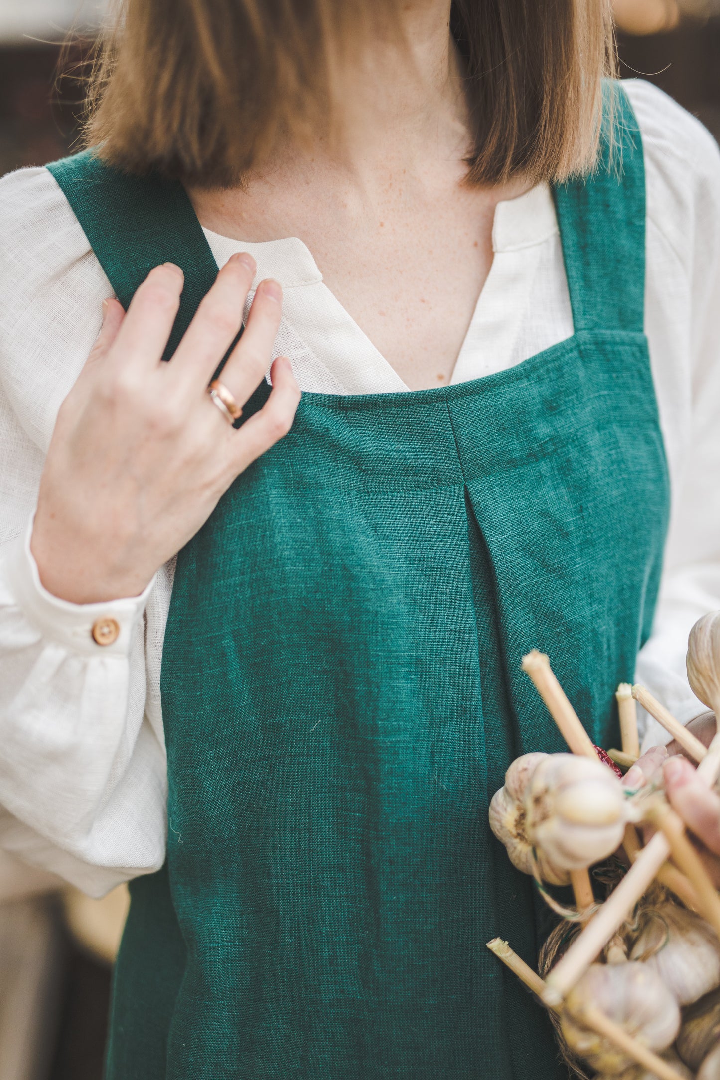 Crossback Pinafore apron with pockets in Emerald green