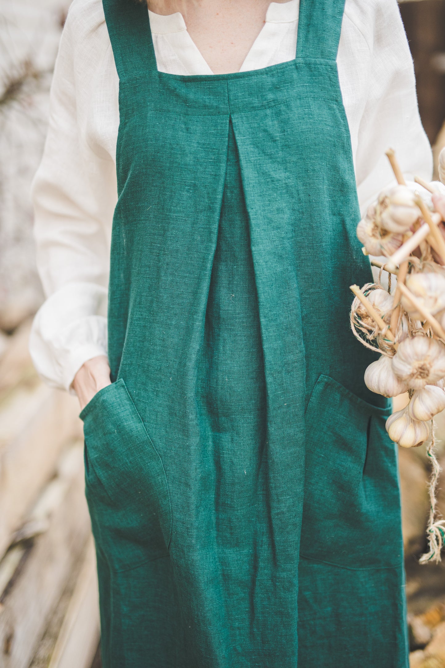 Crossback Pinafore apron with pockets in Emerald green