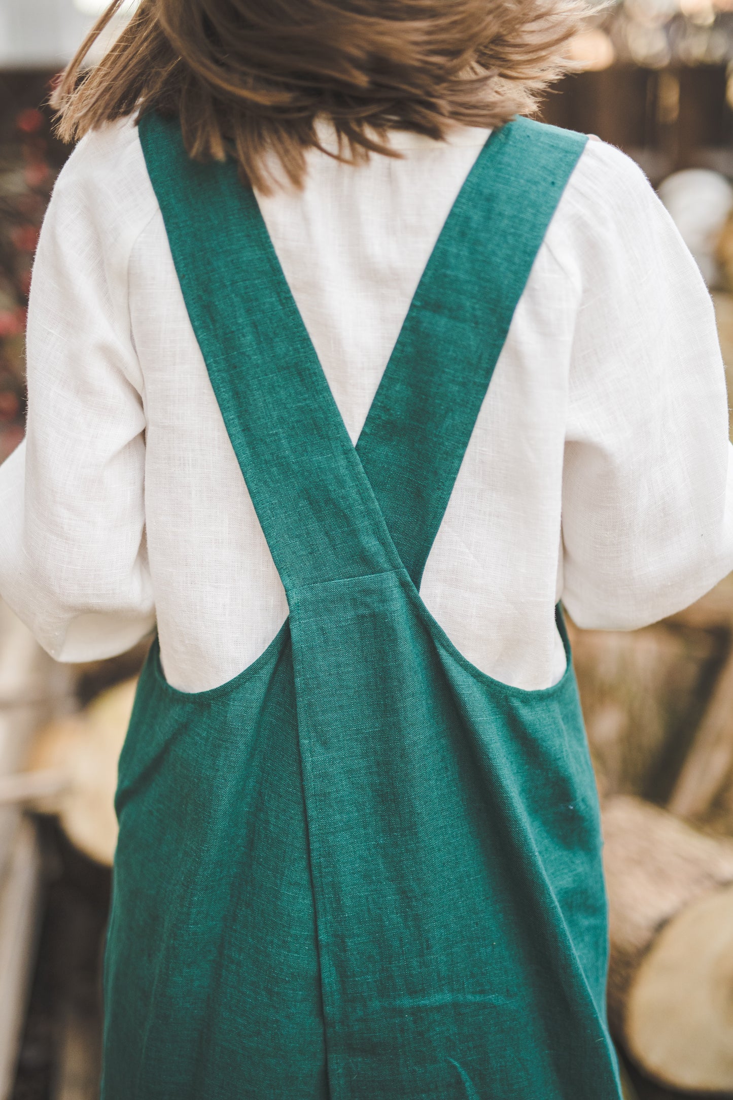 Crossback Pinafore apron with pockets in Emerald green