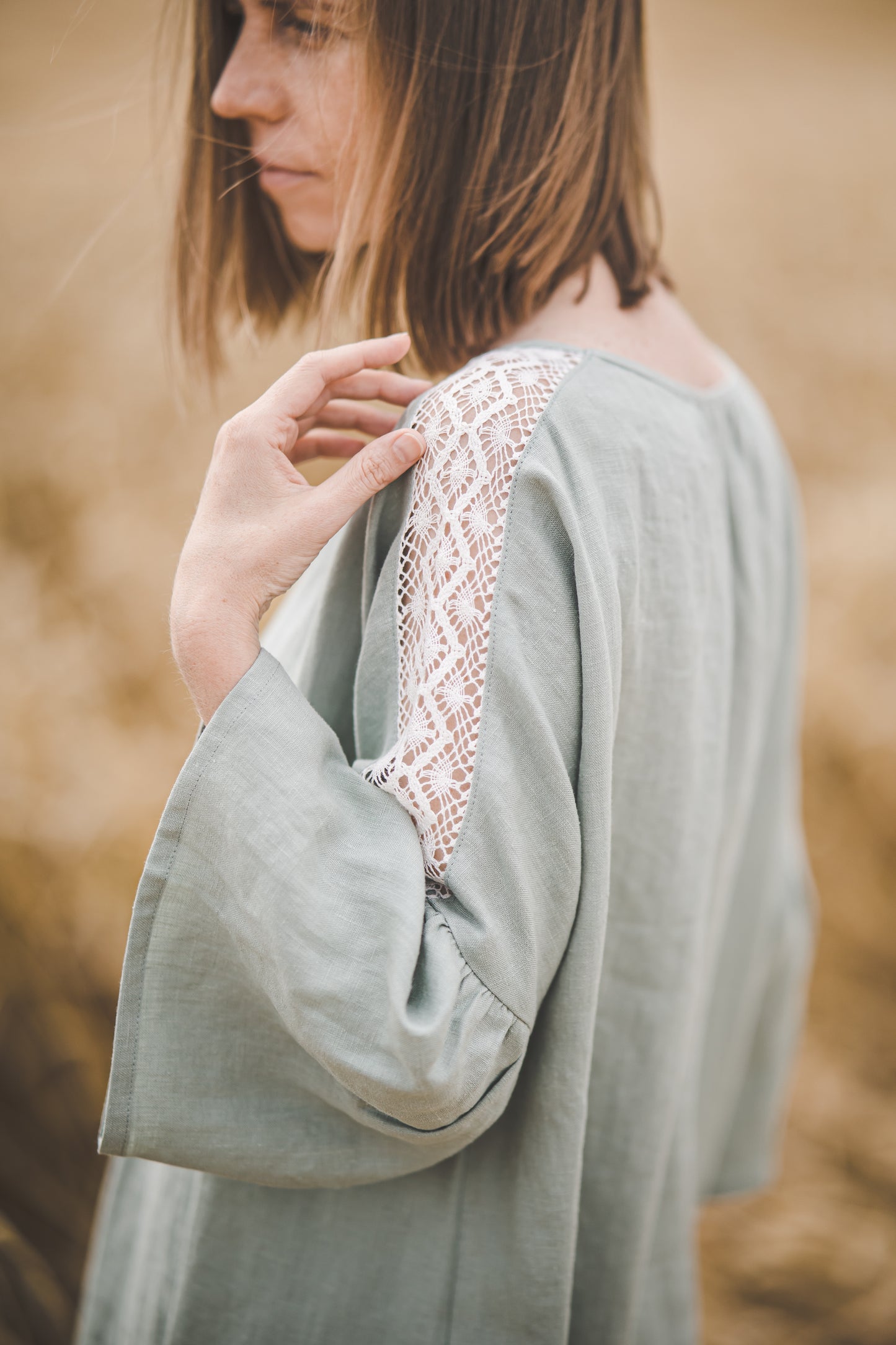 RŪTA midi linen dress with crochet lace in Light sage color